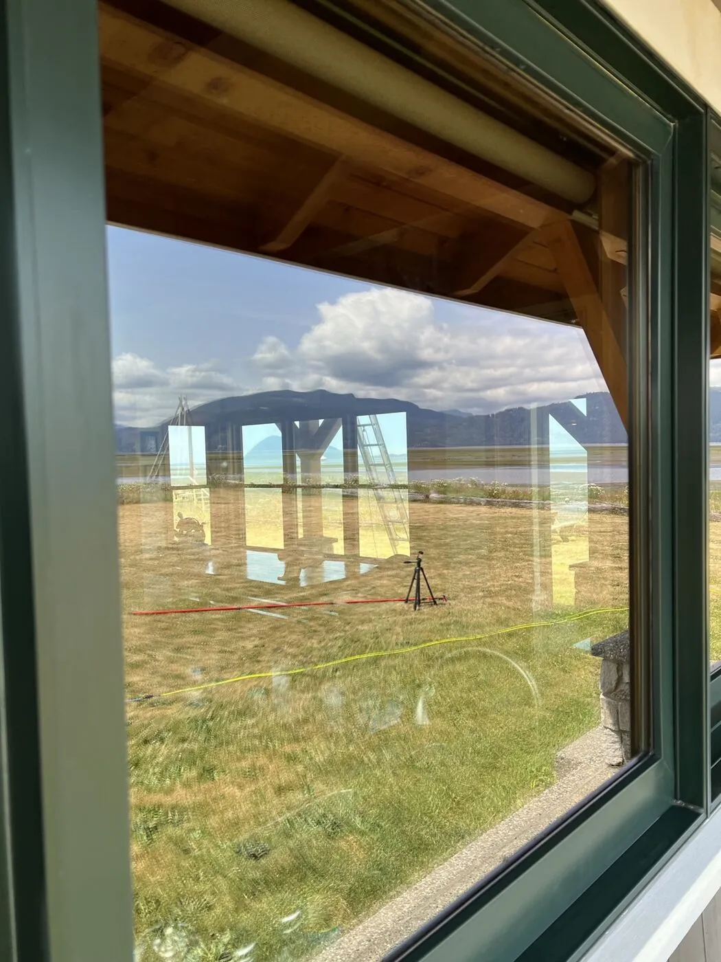 The same waterfront window after cleaning, clear glass and an unobstructed view to the water